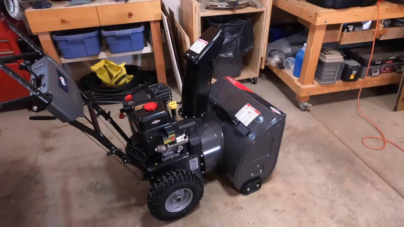 Briggs & Stratton snow blower standing in the garage