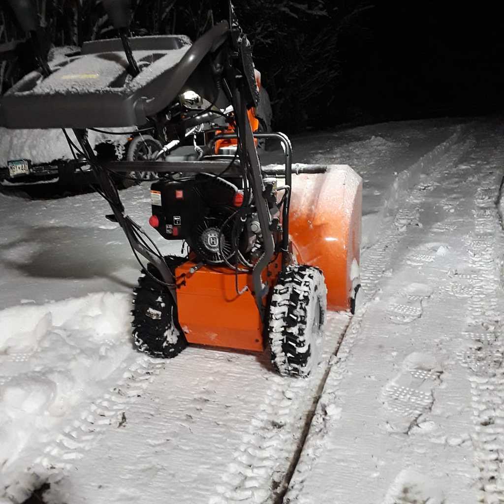 HUSQVARNA ST224 2 Stage Snow Blower With Electric Start while clearing snow