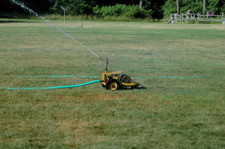 Traveling sprinkler on the grass