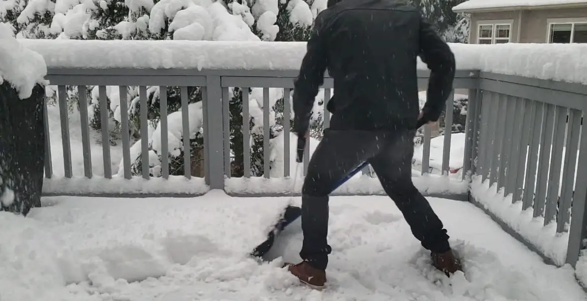 Man shovels snow with Snow Joe Shovelution