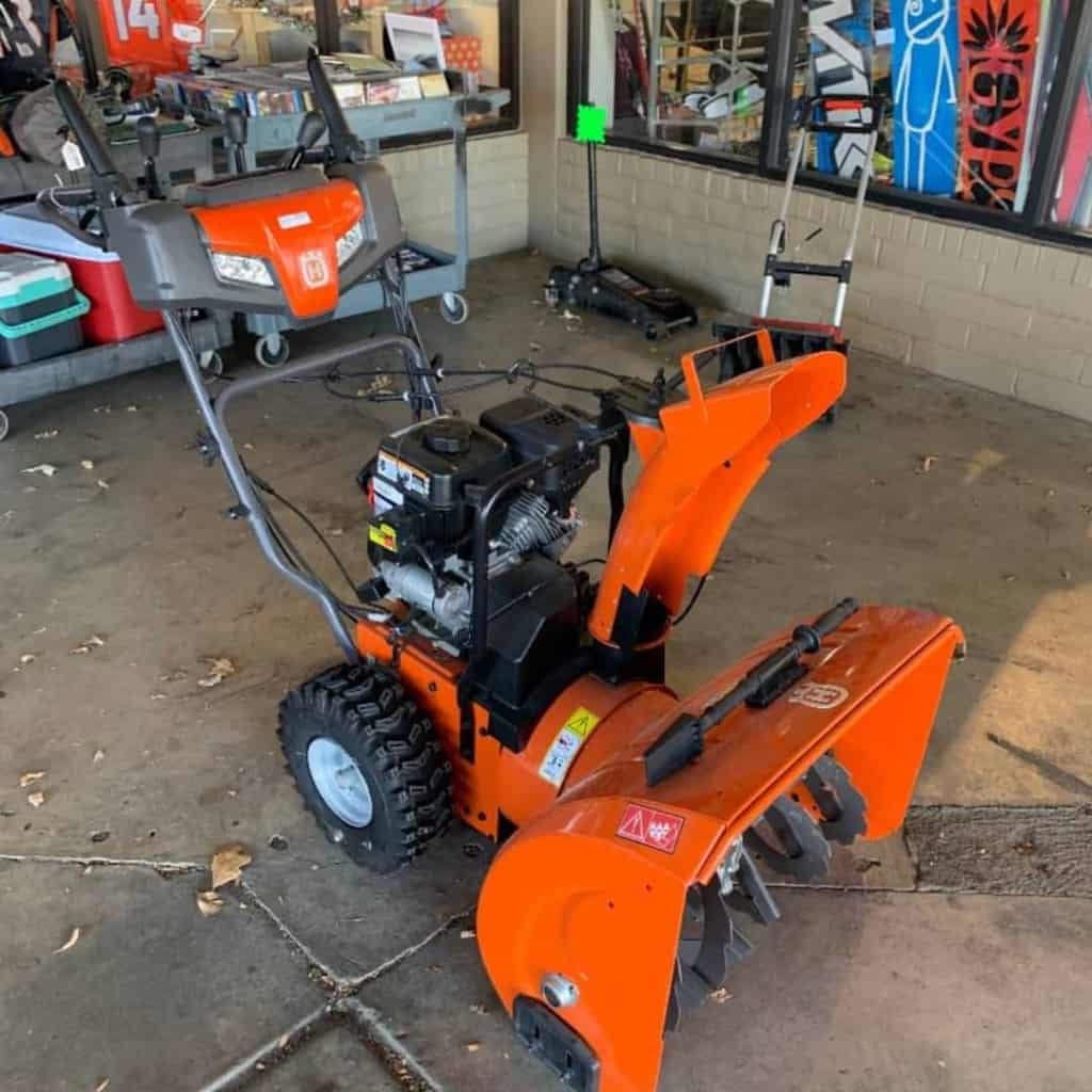 There is a Husqvarna Snow Blower in the garage