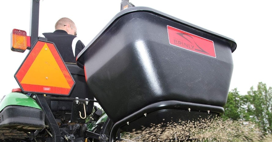 Brinly BS36BH broadcast spreader in use