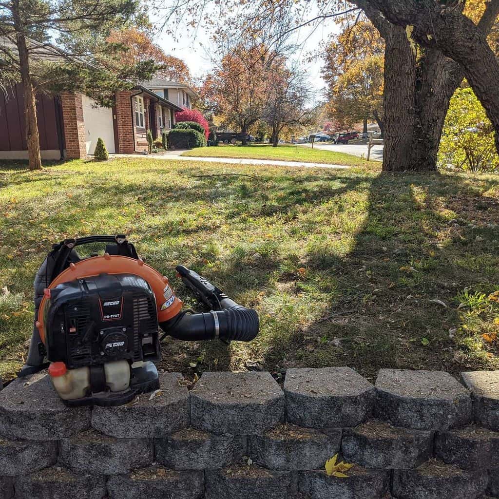 There is an Echo Backpack Blower with Tube Mounted Throttle on the wall