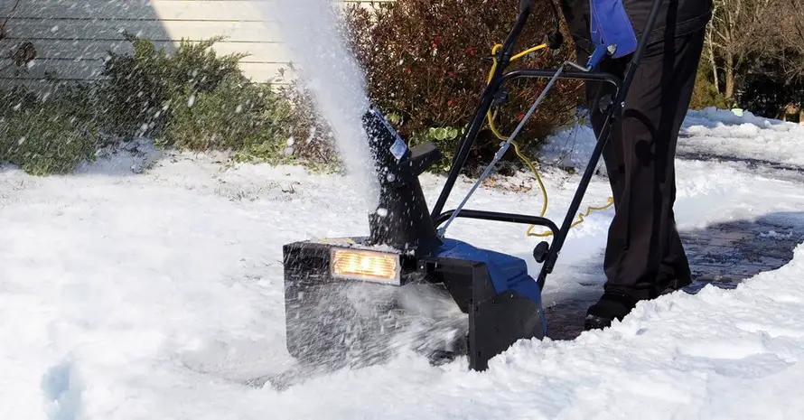 Man Are Blowing Snow With Snow Blower