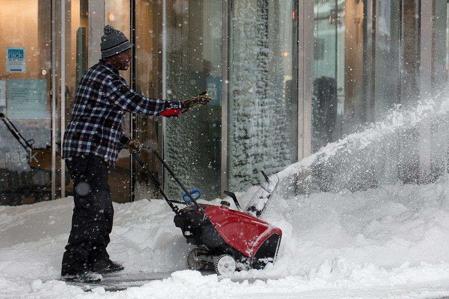 corded-snow-blower-and-human