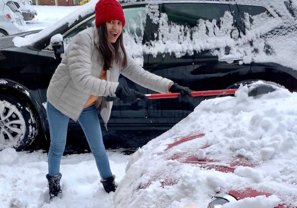 Woman shoves snow