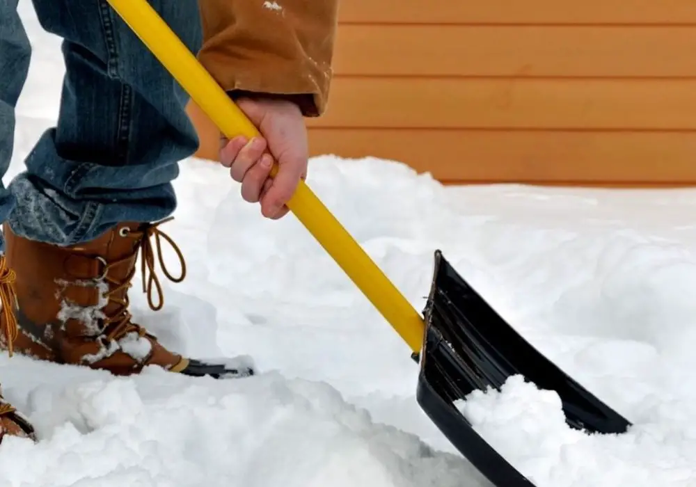 Shovel snow with shovel