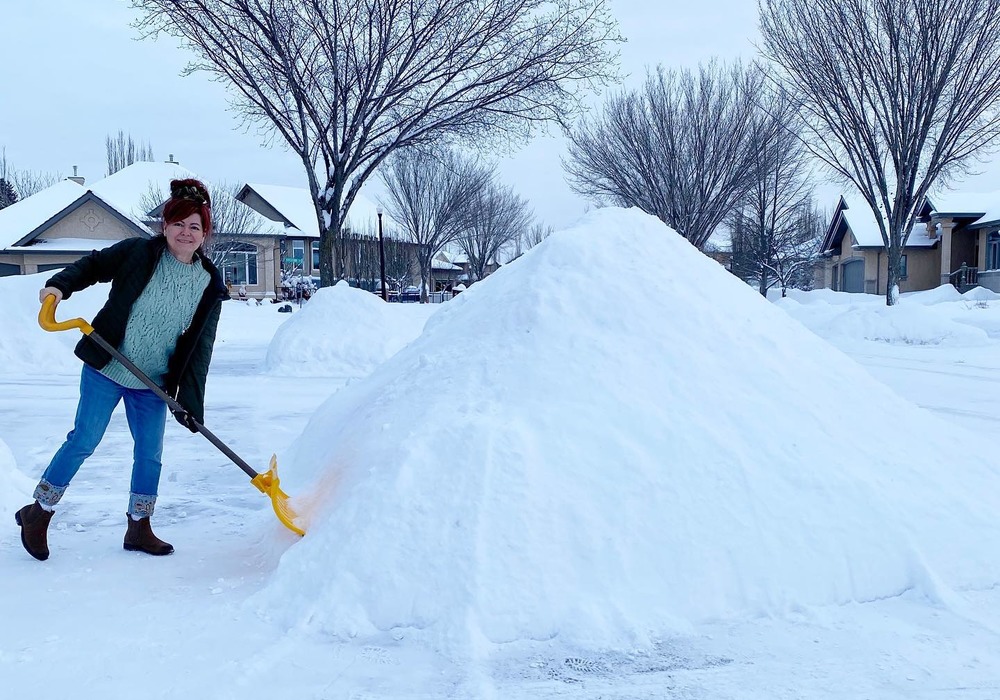 Woman is working with shovel