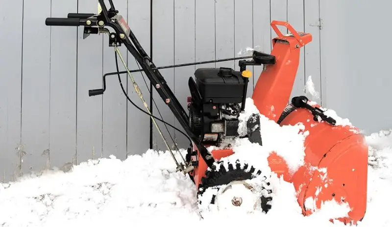 snowblower covered in snow